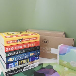 A stack of mixed genre books