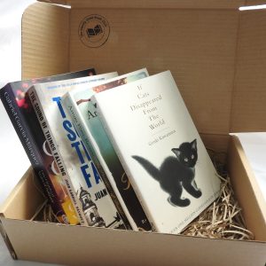 A selection of World Literature paperbacks in a cardboard mailing box